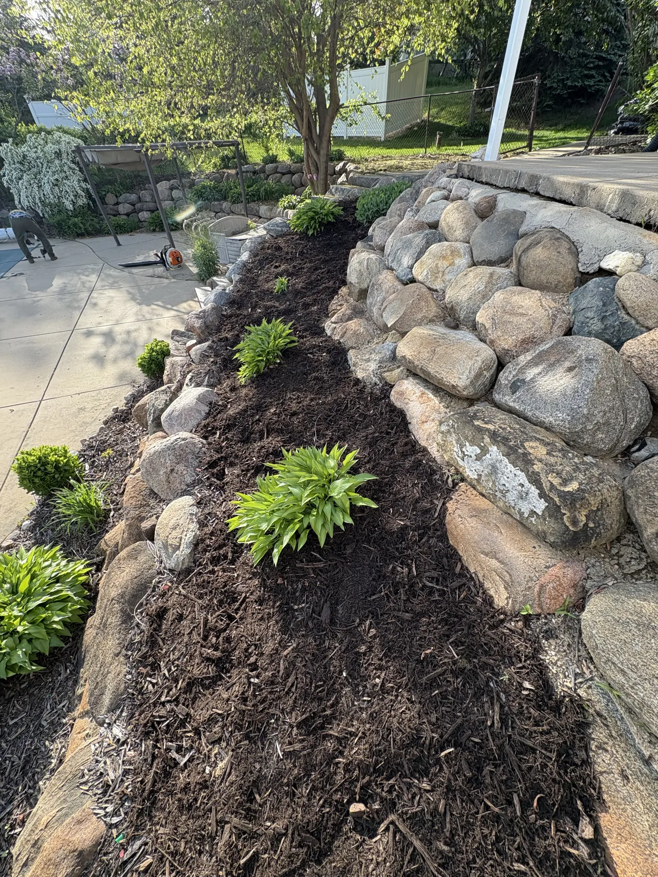 Mulch bed with natural stone edge